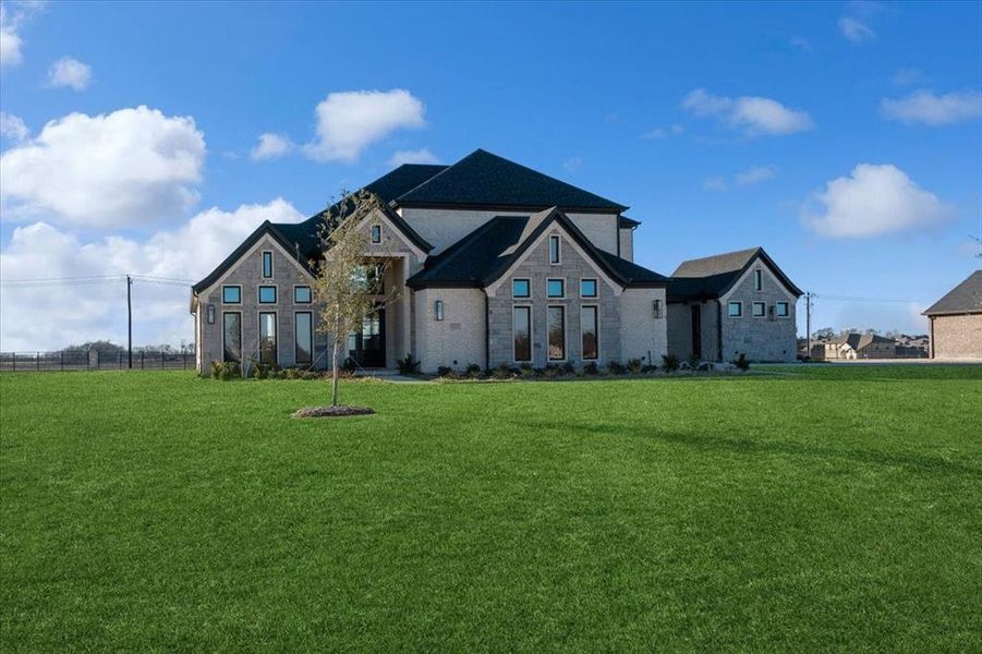 English style home with a front yard