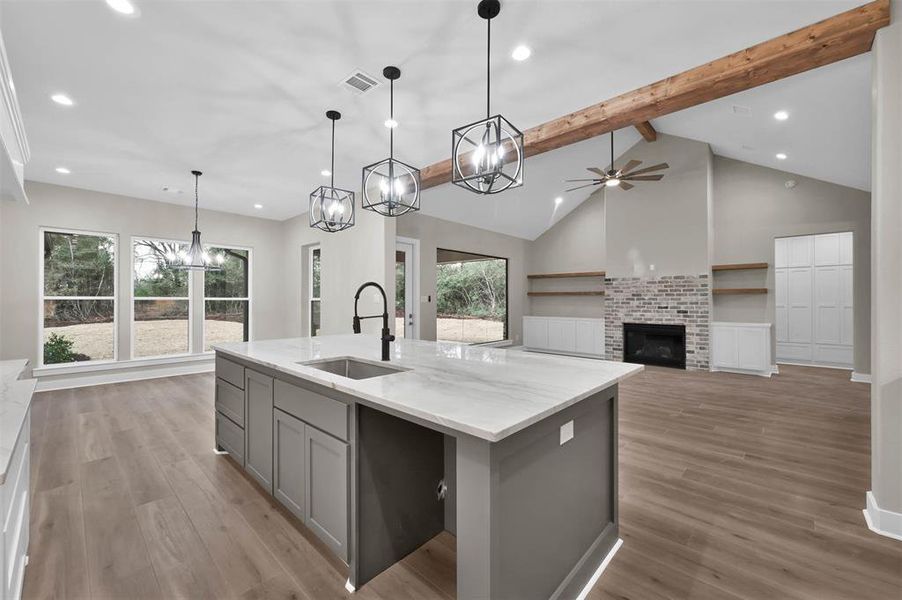 An open view of your kitchen, living area and breakfast nook.