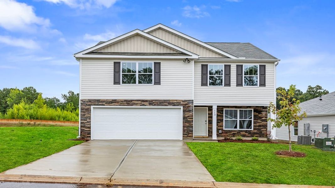 Front exterior of a new home in Bentley Park, Greenwood, SC, highlighting curb appeal (Image 1). Front exterior of a new home in Bentley Park, Greenwood, SC, highlighting curb appeal (Image 1).