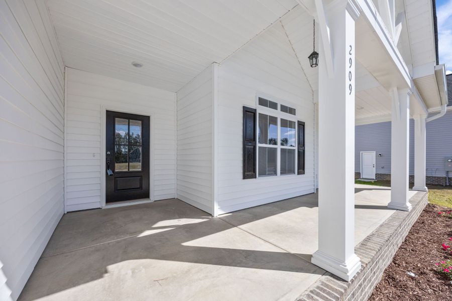 Exterior details and patio area of a home in The Preserve at Langston, Winterville (Image 4).