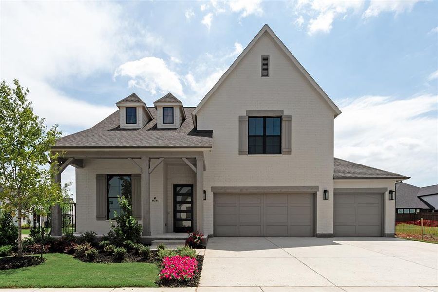 Front exterior of a new home in Estates at Rockhill, Frisco, TX, highlighting curb appeal (Image 1). Front exterior of a new home in Estates at Rockhill, Frisco, TX, highlighting curb appeal (Image 1).