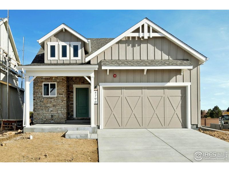 Front exterior of a new home in Wilson Commons, Loveland, CO, highlighting curb appeal (Image 1). Front exterior of a new home in Wilson Commons, Loveland, CO, highlighting curb appeal (Image 1).
