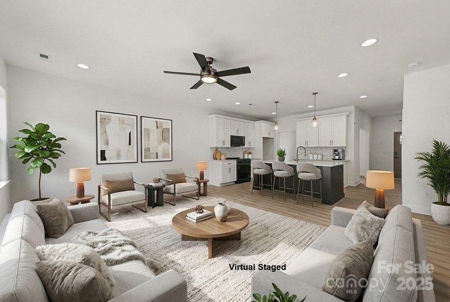 Open concept design features a kitchen that directly overlooks and connects to the family room, creating a spacious and inviting living area. Open concept design features a kitchen that directly overlooks and connects to the family room, creating a spacious and inviting living area.