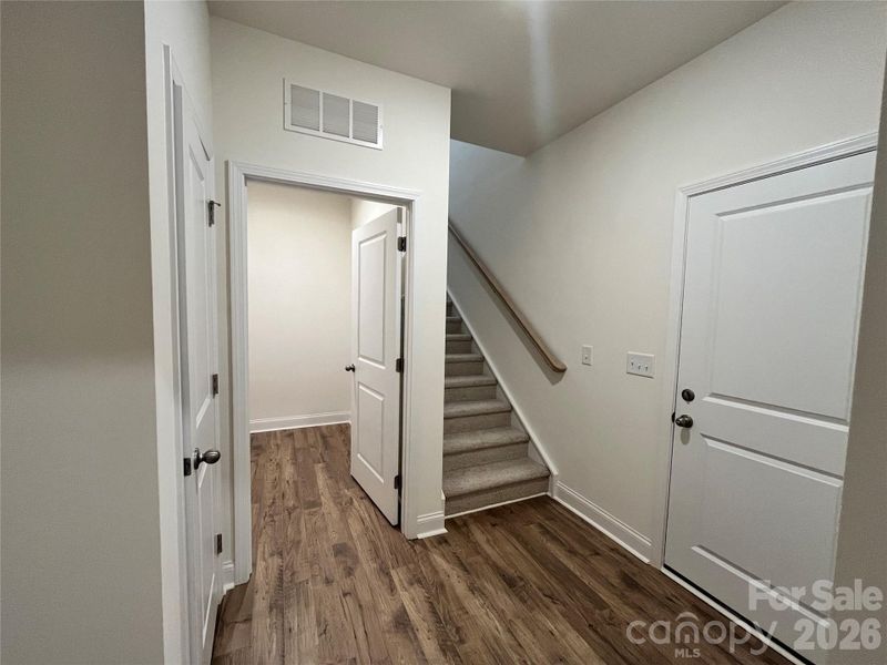 Garage entry, laundry and stairs leading to the loft.