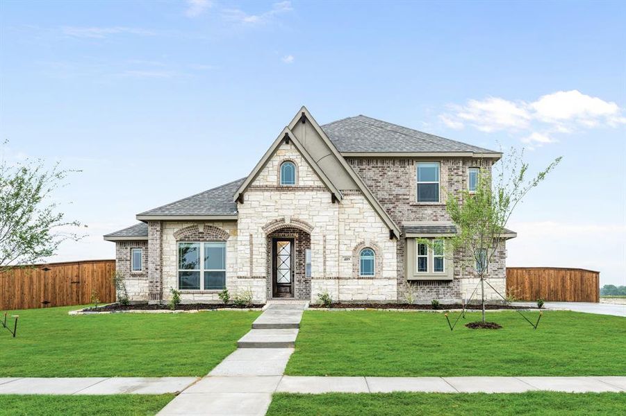 Front exterior of a new home in Glenbrook, Red Oak, TX, highlighting curb appeal (Image 2).