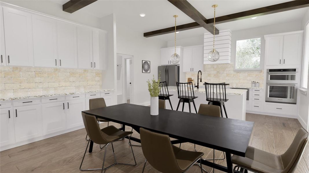 The dining room includes additional couterspace and cabinets.