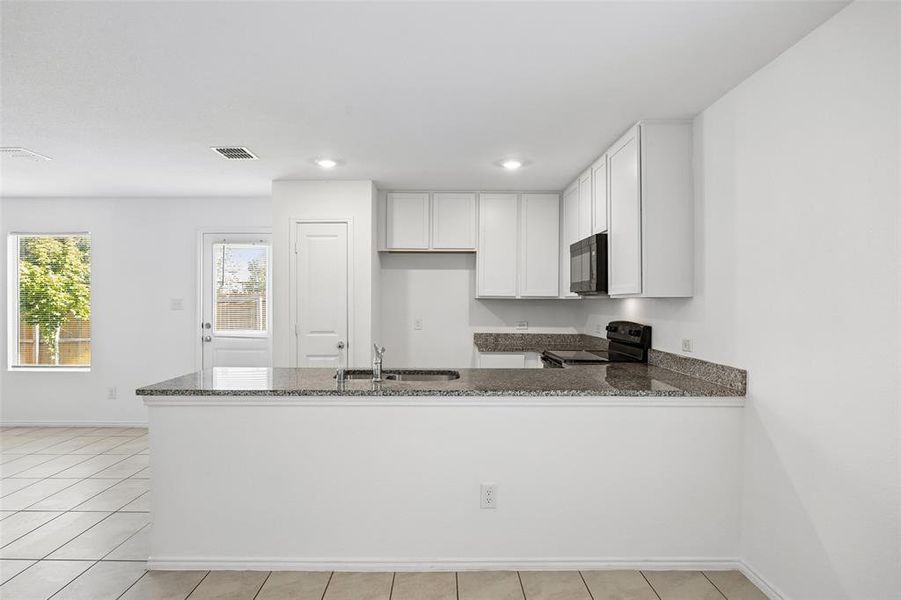 Furnished interior view inside a new home in Trinity West, Dallas (Image 6).