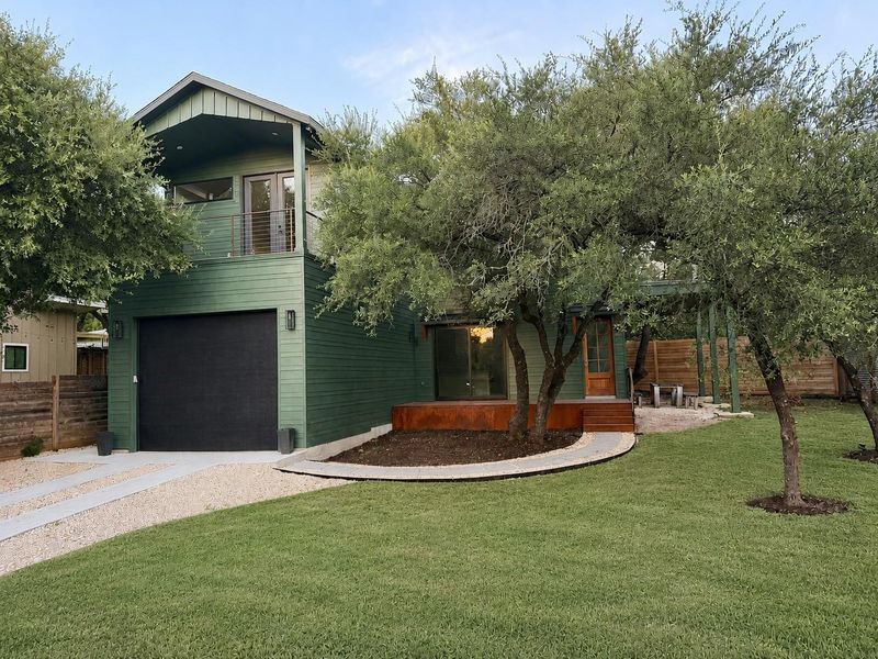 A striking and modern dwelling with mature trees offering natural shade. (note: some grass has been virtually filled in) A striking and modern dwelling with mature trees offering natural shade. (note: some grass has been virtually filled in)