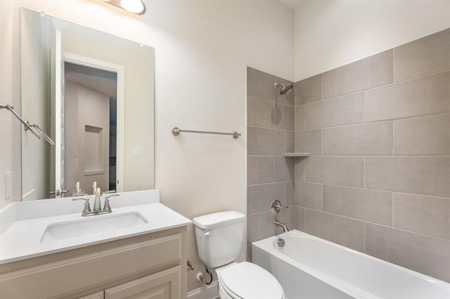 Bathroom with vanity and tub / shower combination