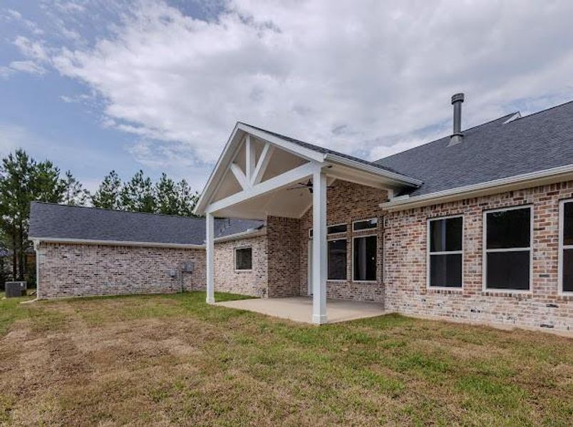 Exterior details and patio area of a home in , Willis (Image 4). Exterior details and patio area of a home in , Willis (Image 4).