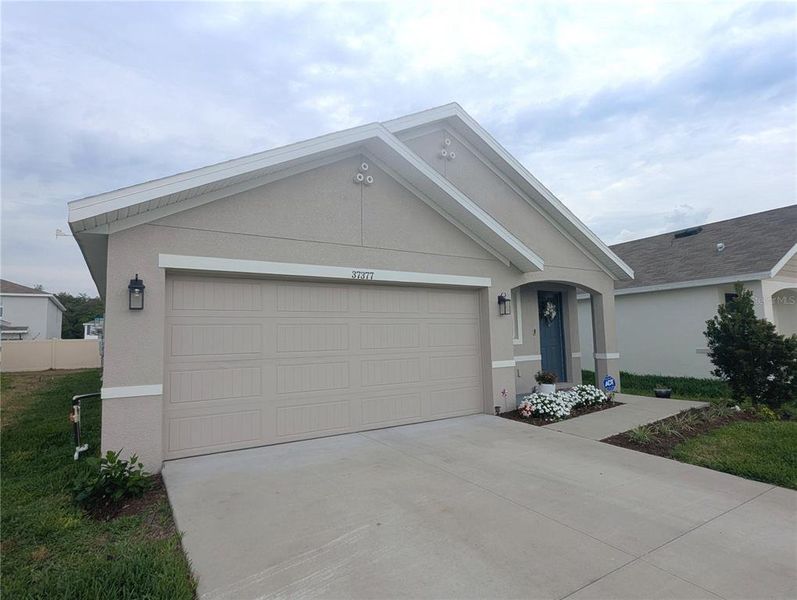 Front exterior of a new home in , Zephyrhills, FL, highlighting curb appeal (Image 21).