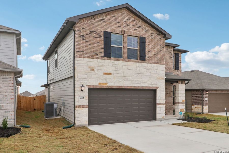 Front exterior of a new home in Legendary Trails - Premier Series, Cibolo, TX, highlighting curb appeal (Image 21).