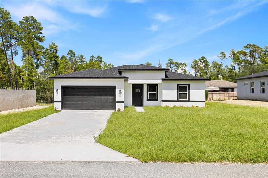 Front exterior of a new home in , Ocala, FL, highlighting curb appeal (Image 18).