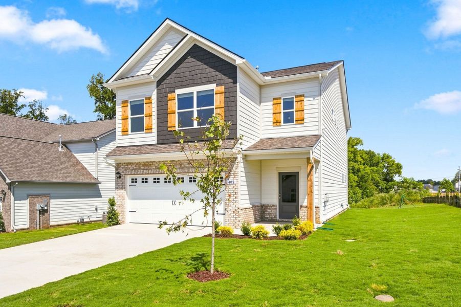 Front exterior of a new home in The Oaks, Clarksville, TN, highlighting curb appeal (Image 20).