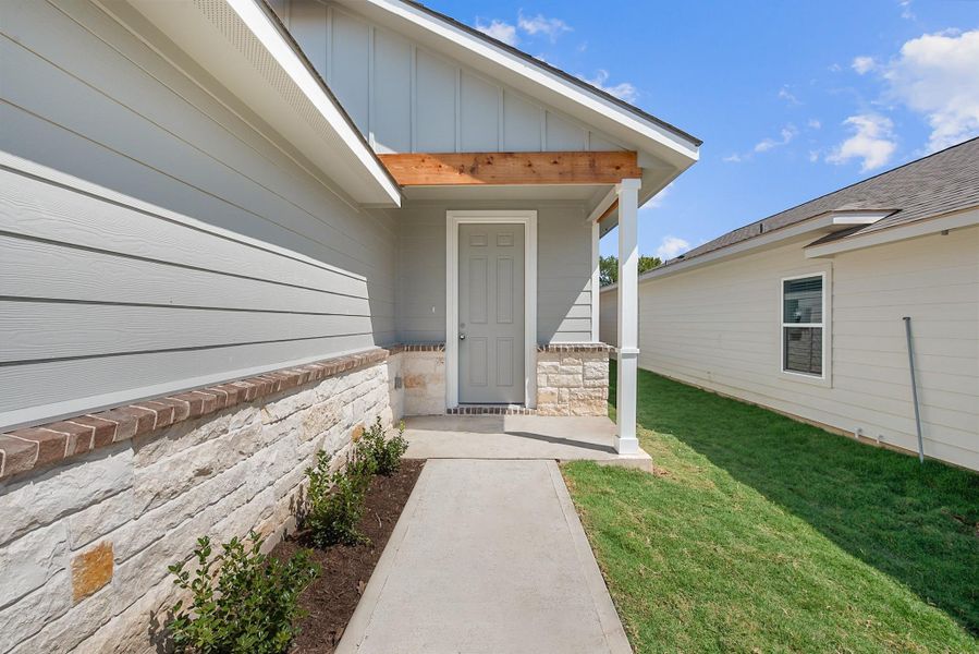 Front exterior of a new home in , College Station, TX, highlighting curb appeal (Image 21).