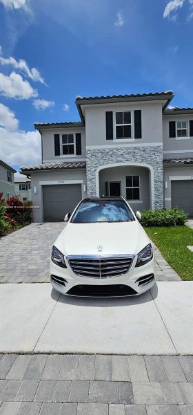 Front exterior of a new home in , Coral Springs, FL, highlighting curb appeal (Image 1).