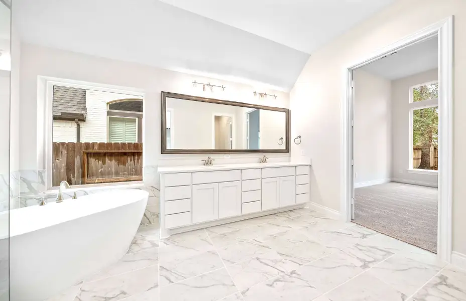 Representative furnished interior of a home built from the 3068 by Ravenna Homes in The Woodlands Hills 65′, Willis (Image 14).