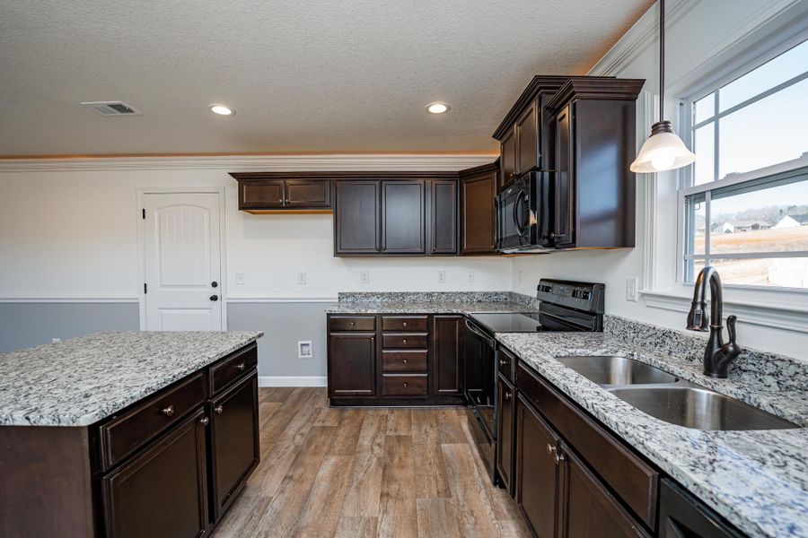 Representative furnished interior of a home built from the Sumter by Enchanted Homes in Lonesome Dove, San Antonio (Image 40).