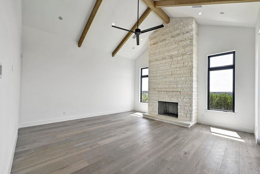 Cozy den with wood-burning fireplace. Cozy den with wood-burning fireplace.