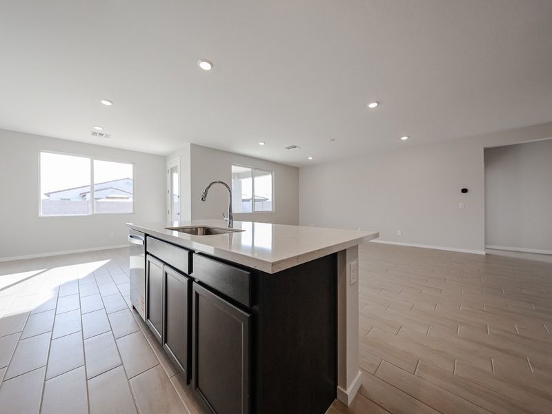 A kitchen with a marble countertop. A kitchen with a marble countertop.
