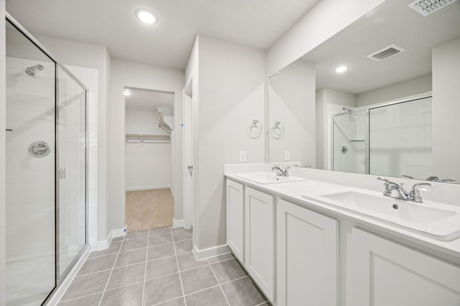 Primary Bathroom in the Hayden home plan by Trophy Signature Homes – REPRESENTATIVE PHOTO