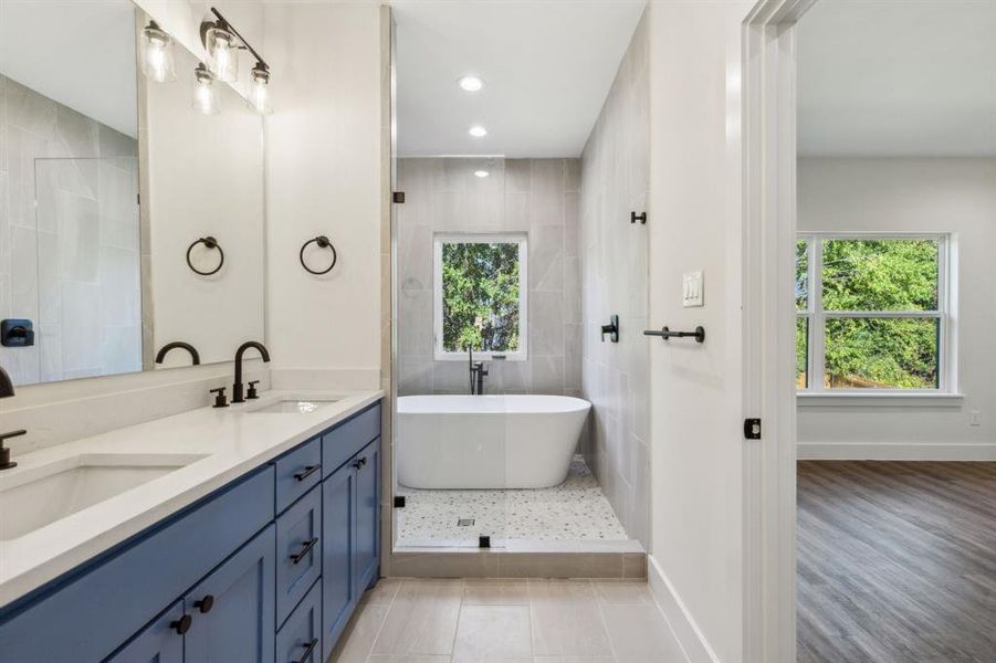 Massive ensuite bath with a soaking tub in a "wet room"