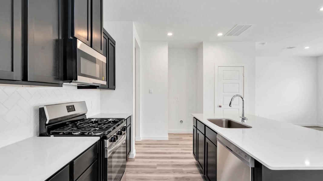 Representative furnished interior of a home built from the Hibiscus by D.R. Horton in City Gate North, Houston (Image 4).