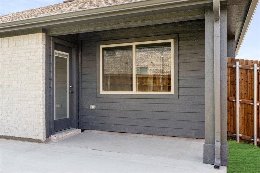 Exterior details and patio area of a home in Bear Creek Elements, Lavon (Image 26).
