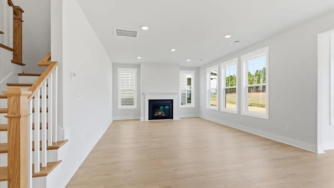 Superior design shines in this open-concept family room with timeless finishes and a modern edge at Foxbank