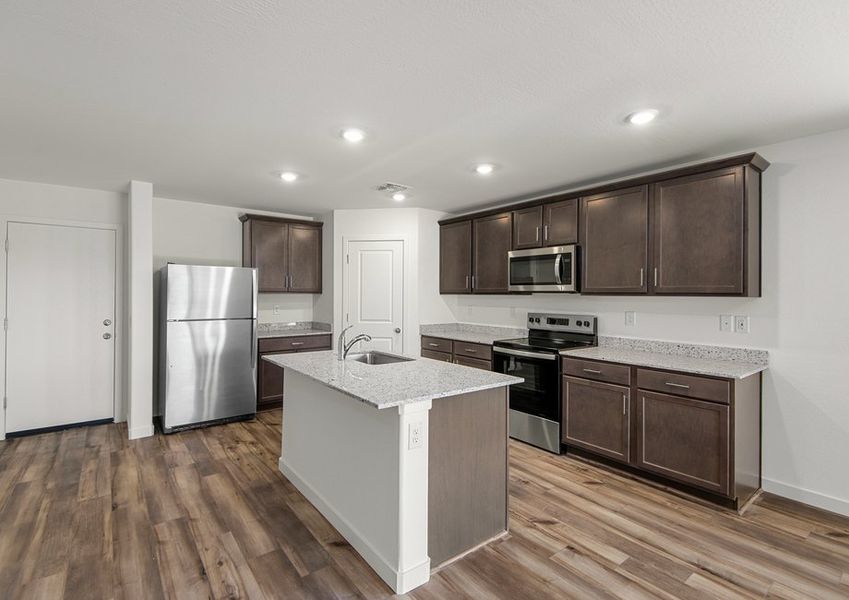 A spacious kitchen island is the perfect spot for food preparation.