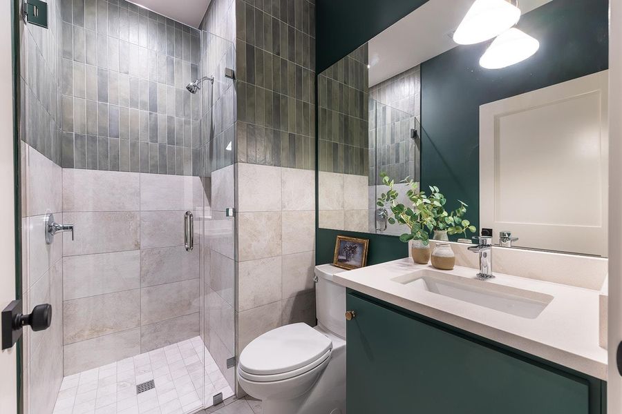Full bathroom featuring vanity and a shower stall