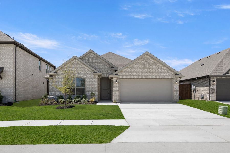 Front exterior of a new home in Meadow Park at The Meadows, Ponder, TX, highlighting curb appeal (Image 1). Front exterior of a new home in Meadow Park at The Meadows, Ponder, TX, highlighting curb appeal (Image 1).