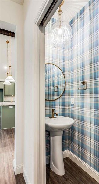 Bathroom with hardwood / wood-style floors and sink