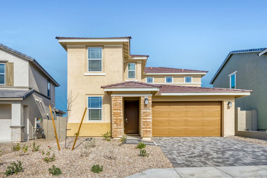 Front exterior of a new home in Teravalis, Buckeye, AZ, highlighting curb appeal (Image 1). Front exterior of a new home in Teravalis, Buckeye, AZ, highlighting curb appeal (Image 1).