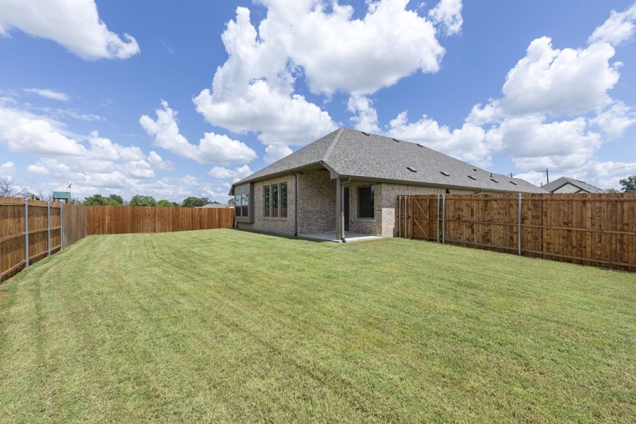 Exterior details and patio area of a home in Keeneland, Aubrey (Image 28).