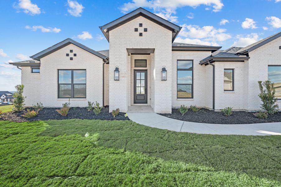 Front exterior of a new home in Rocky Top Ranch, Reno, TX, highlighting curb appeal (Image 23).