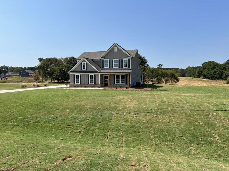 Front exterior of a new home in , Good Hope, GA, highlighting curb appeal (Image 16). Front exterior of a new home in , Good Hope, GA, highlighting curb appeal (Image 16).
