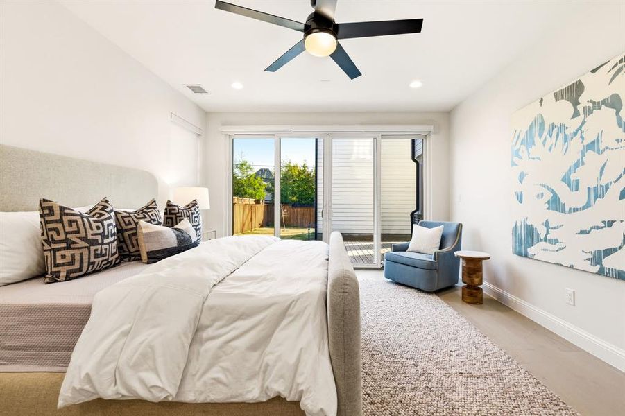 Bedroom with light wood finished floors, access to exterior, a ceiling fan, and recessed lighting