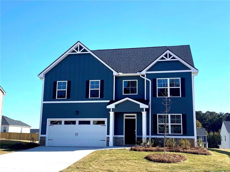 Front exterior of a new home in Preserve at Dove Creek, Winder, GA, highlighting curb appeal (Image 2).