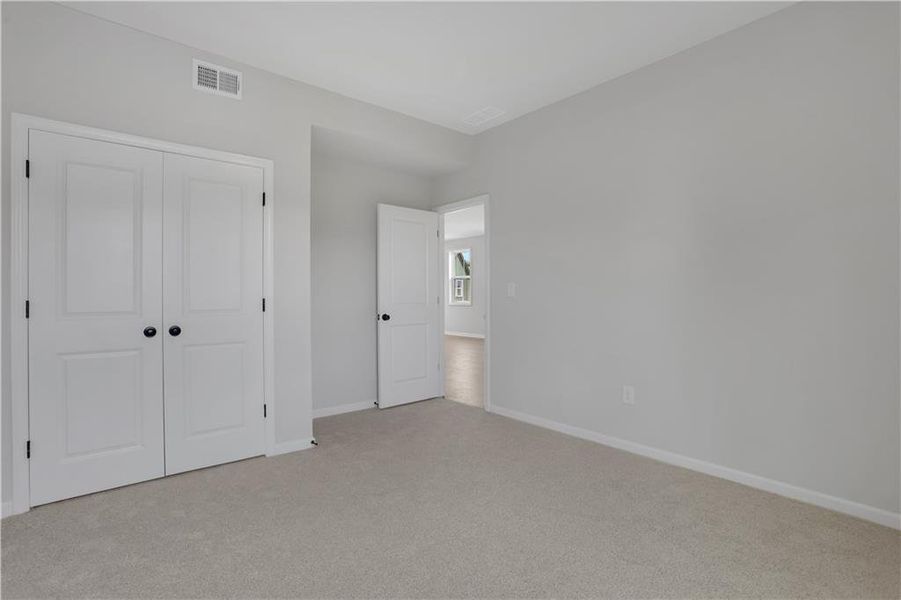 Spacious, unfurnished interior of a new home in The Paddocks at Doc Hughes, Buford (Image 22).