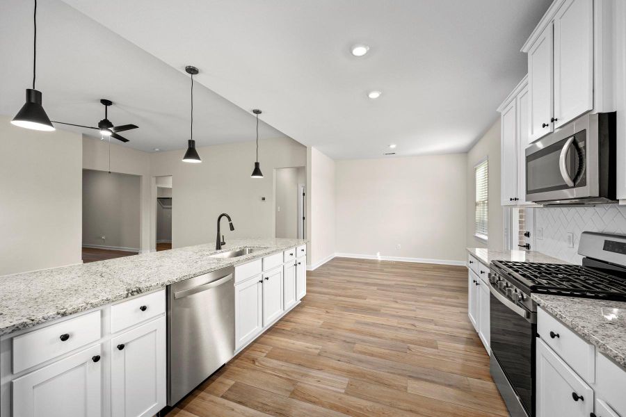 Furnished interior view inside a new home in Sunterra, Katy (Image 6).