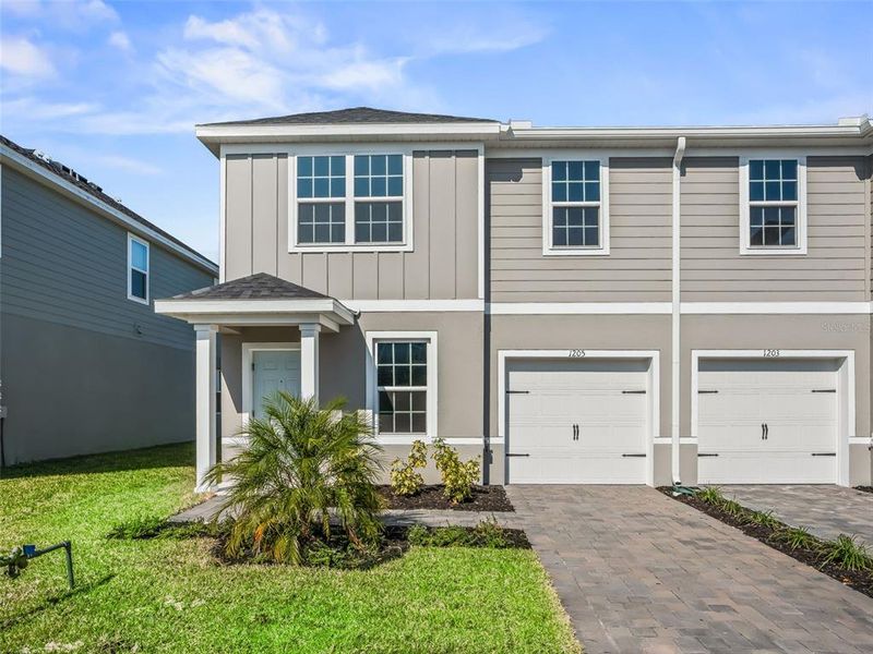 Front exterior of a new home in , Lady Lake, FL, highlighting curb appeal (Image 27).