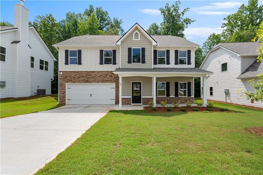 Front exterior of a new home in , Villa Rica, GA, highlighting curb appeal (Image 1). Front exterior of a new home in , Villa Rica, GA, highlighting curb appeal (Image 1).