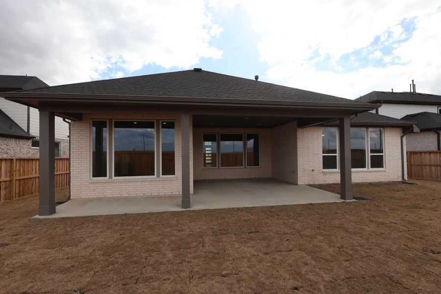 Exterior details and patio area of a home in Dunham Pointe, Cypress (Image 21).