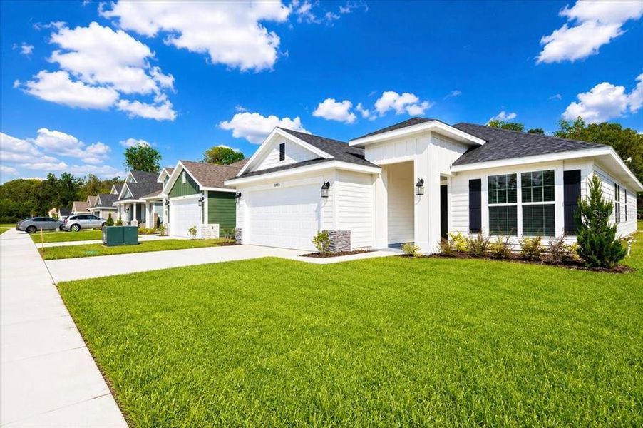Front exterior of a new home in Country Way South, Newberry, FL, highlighting curb appeal (Image 27).
