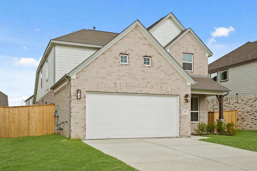 Front exterior of a new home in Huntington Place, Rosharon, TX, highlighting curb appeal (Image 16). Front exterior of a new home in Huntington Place, Rosharon, TX, highlighting curb appeal (Image 16).