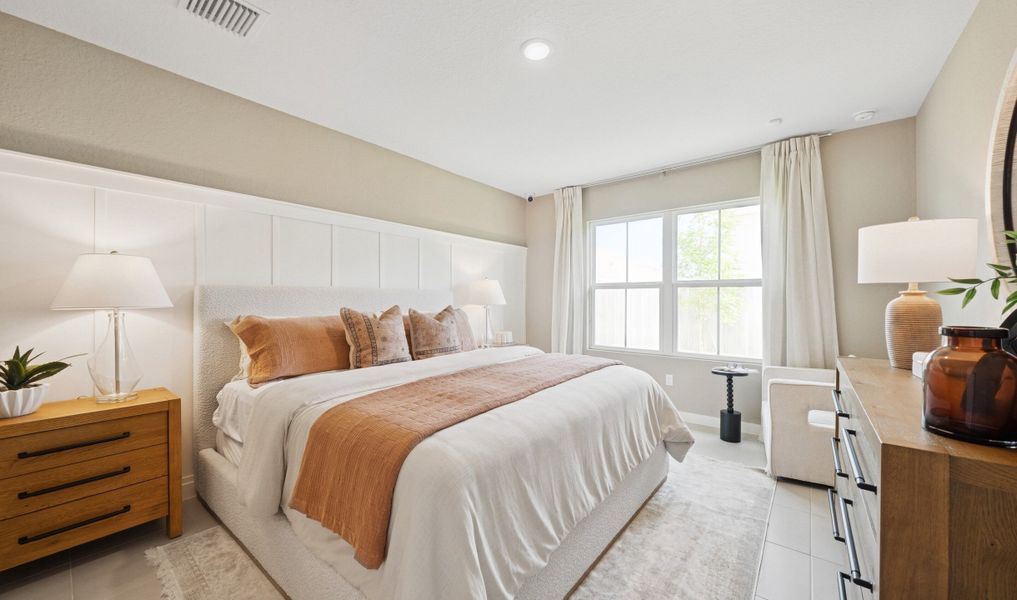 Primary suite with decorative feature wall