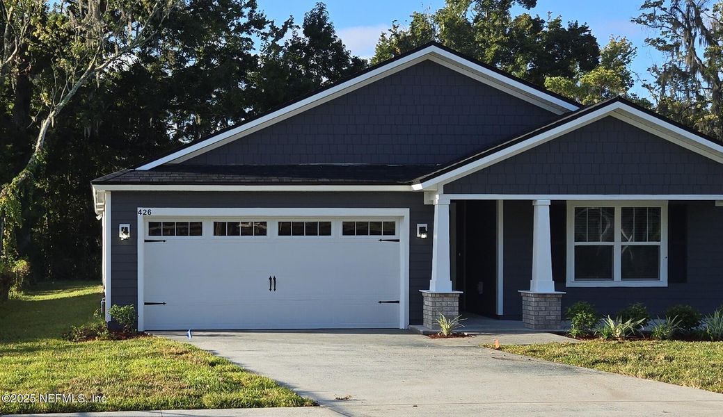 Front exterior of a new home in , Jacksonville, FL, highlighting curb appeal (Image 1).