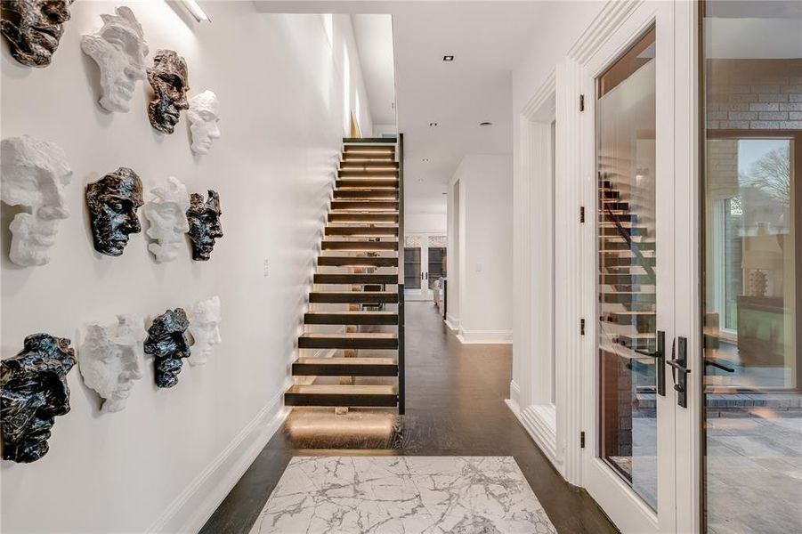 Front Foyer with view of stairs and Dining Hallway