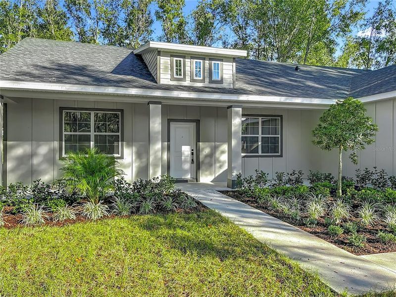 Front exterior of a new home in , Lake Helen, FL, highlighting curb appeal (Image 2). Front exterior of a new home in , Lake Helen, FL, highlighting curb appeal (Image 2).